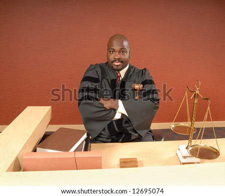 Judge in his courtroom listening to the trial