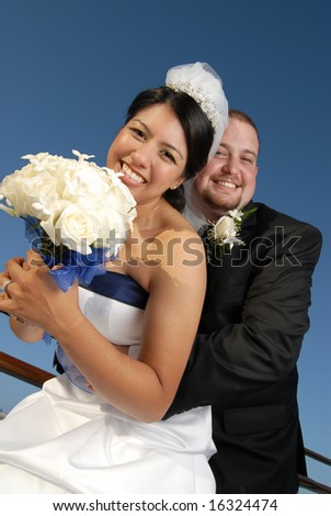 Happy, fun couple on their wedding day