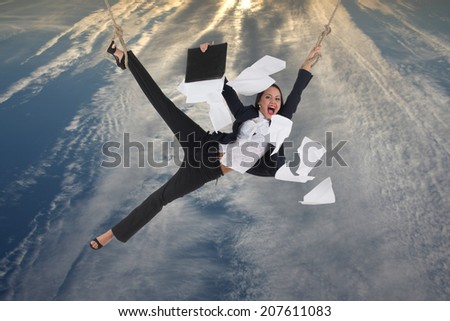 Risking business lady with flying papers near her is soaring above the city