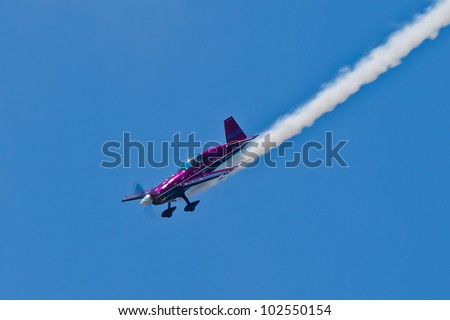 SANTA ROSA, CA - AUG 20: Vicky Benzing in her purple Extra 300S demonstrate high performance aerobatics during the Wings Over Wine Country Air Show, on August 20, 2011, Santa Rosa, CA.