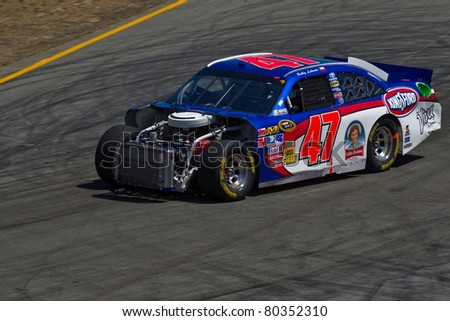 SONOMA, CA - JUNE 26: Bobby Labonte (47) at speed on  a damaged car during 2011 Toyota/Save Mart 350 Commercial, the NASCAR Sprint Cup Series race on June 26, 2011 at the Infineon Raceway, Sonoma, CA.