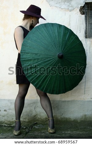 beautiful vintage woman holding an umbrella