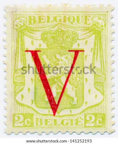 BELGIUM - CIRCA 1944: A stamp printed in Belgium shows Belgian heraldic lion and V, circa 1944