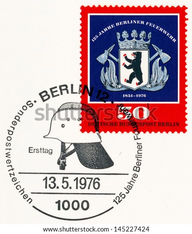 WEST BERLIN - CIRCA 1976: A stamp printed in Germany, shows Berlin Fire Brigade Emblem and Fire helmet, circa 1976