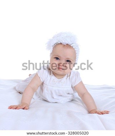 Adorable baby girl  in cute  clothes on blanket on a white background