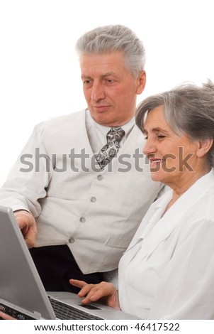elderly man and woman looking at laptop white background