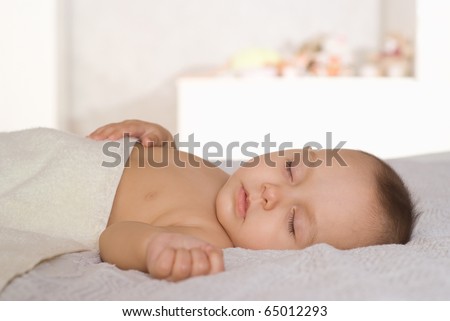 nice happy baby sleep on a white background
