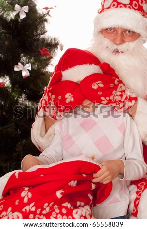 Santa gives presents to child on a white background