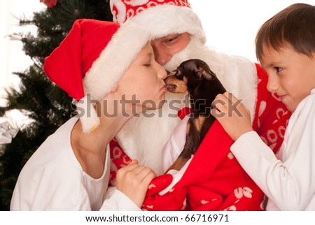 Santa gives presents to children on a white