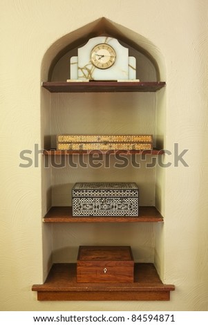 Built in shelf with boxes and clock
