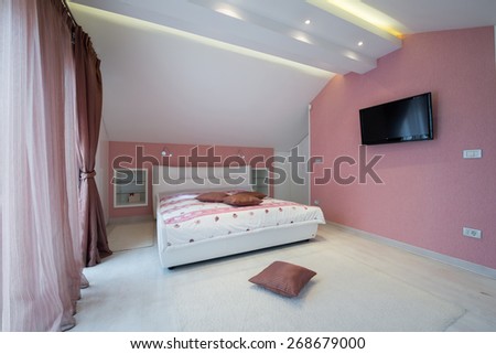 Interior of a bright white cozy bedroom in luxury loft apartment