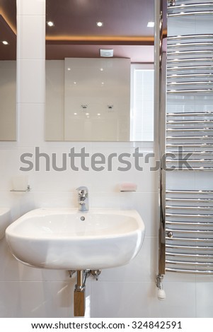 Modern bathroom interior with heated towel rail