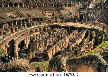 Interior view of the Rome colosseum with tourists. Pseudo HDR image created from a single RAW file