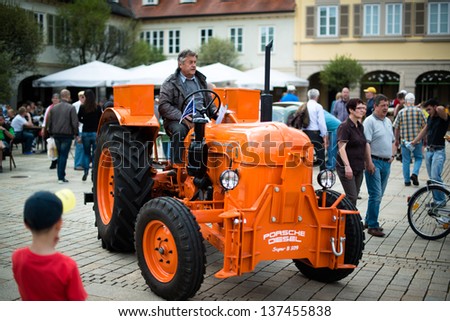 LUDWIGSBURG, GERMANY - MAY 5: A classic Porsche tractor model Diesel Super B 309 from 1963 is presented during the eMotionen show on the market square on May 5, 2013 in Ludwigsburg, Germany.
