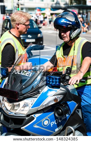 STUTTGART, GERMANY - JULY 27, 2013: Police during Christopher Street Day on July 27, 2013 in Stuttgart, Germany.The gay and lesbian pride festival is happening for the 17th time already in Stuttgart