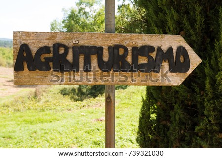 Handmade wooden agriturismo sign in Tuscany - agritourism is a typical concept of bed and breakfast in a farming environment in Italy. Foto d'archivio © 