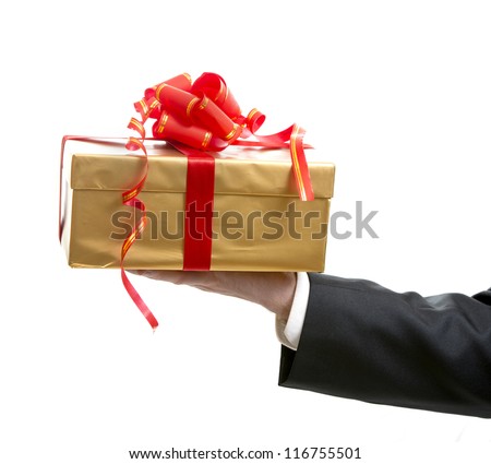 Man in suit giving a present close up