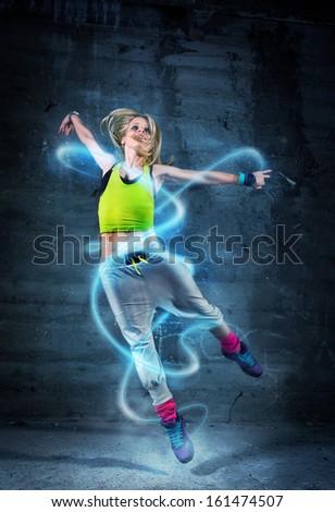 Woman dancing in urban environment with abstract lines