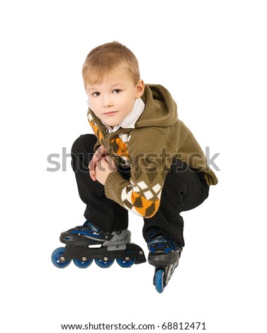little beautiful baby boy on roller skates