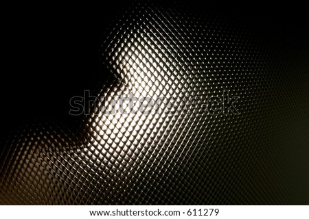 A face backlit with a pattern.