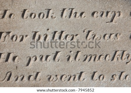 Engraved words on the headstone of a grave.