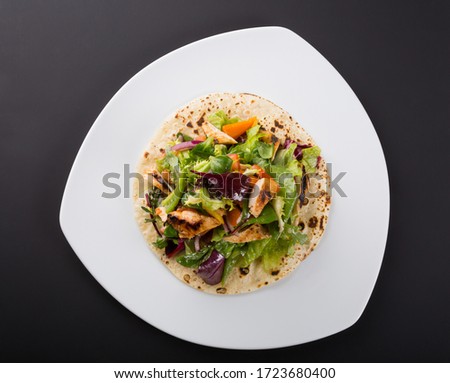 Similar – Image, Stock Photo Grilled spinach fajitas served with cottage cheese and sauce