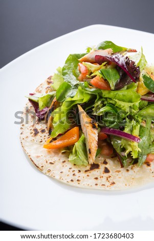 Similar – Image, Stock Photo Grilled spinach fajitas served with cottage cheese and sauce