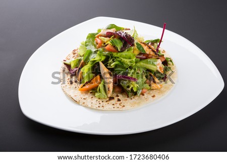 Similar – Image, Stock Photo Grilled spinach fajitas served with cottage cheese and sauce