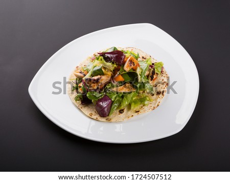 Similar – Image, Stock Photo Grilled spinach fajitas served with cottage cheese and sauce