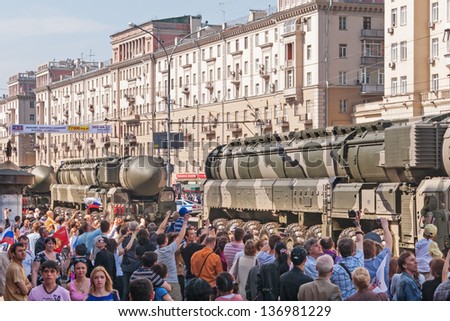 MOSCOW/RUSSIA - MAY 9: People look at Russian Army RT-2UTTKh Topol-M (SS-27 Sickle B) intercontinental ballistic missile in parade devoted to 65th anniversary of Victory Day on May 9, 2010 in Moscow.
