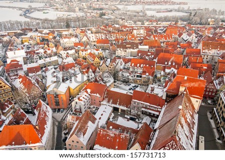 Winter panorama of medieval town within fortified wall. Top view from \