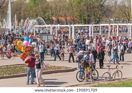 MOSCOW/RUSSIA - MAY 9: People walk in Gorky Park during festivities devoted to Victory Day on May 9, 2013 in Moscow.