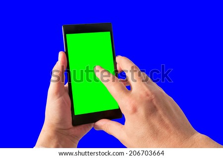 Man holds in hand and taps by index finger tablet PC in portrait mode with green screen isolated on white. Chroma key screen for placement of your own content.