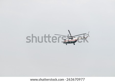 MOSCOW/RUSSIA - AUGUST 22: Mil Mi-8 (Hip) medium transport helicopter of EMERCOM (Emergency Control Ministry of Russia) flies against sky background on August 22, 2014 in Moscow.