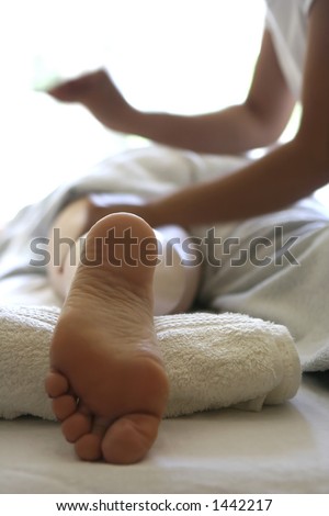 A lady receiving a massage as part of a holistic massage treatment