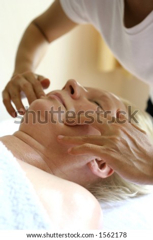A facial massage as part of a holistic massage treatment