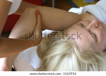Girl during Massaging Her Arm Stock Image - Image of care