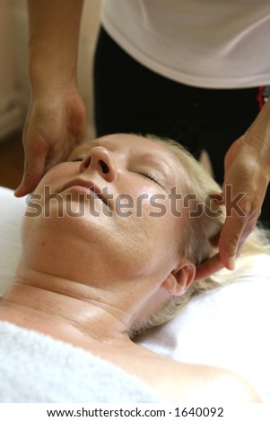 A patient receiving a holistic head massage
