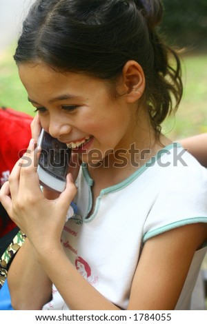 A happy young girl on the phone. Concept : Missing you