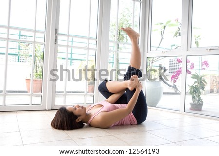 Young female stretching her calf muscle as part of exercise routine