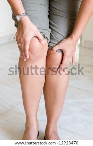 Woman suffering painful knee joint