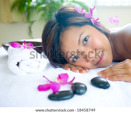 Beautiful woman relaxing in day spa