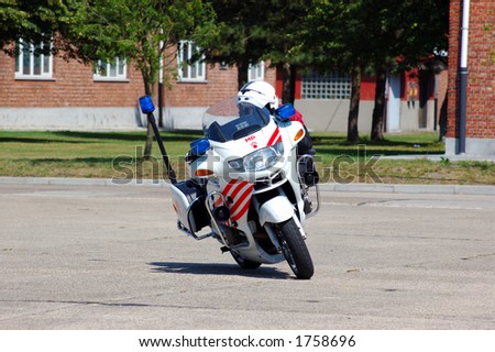 military police intervention.  Officer on bike in pursuit of suspect.  Safety, speed concept.