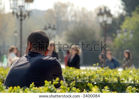 man relaxing in the park, taking a break on a  sunny spring, summer day