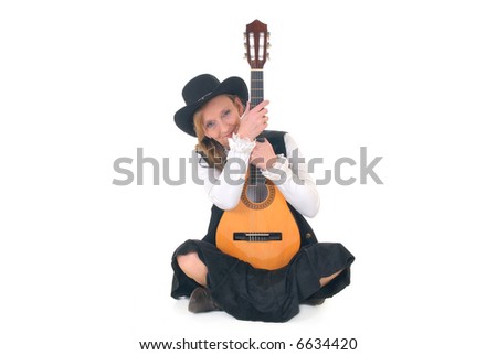 Middle aged country and western singer woman with traditional dress posing with guitar. Big smile on face. White background
