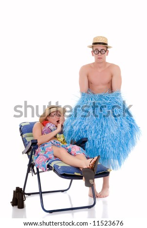 Attractive young couple in beach clothing, going on vacation.  Studio shot, white background, reflective surface