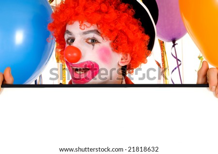 Colorful dressed male holiday clown with balloons, room for text. Studio shot.