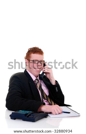 Handsome red-headed smiling young male secretary, help desk assistant making phone call. White background, studio shot.