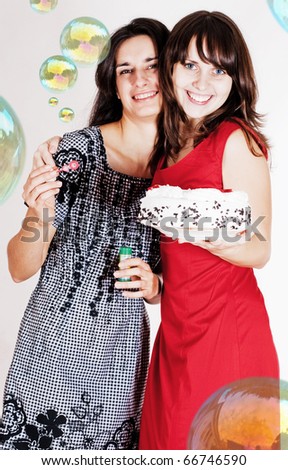 happy beauty girls with soap balls and sweet cake