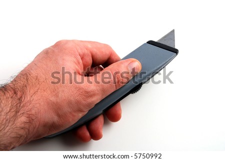 stock pictures of a box cutter with a very sharp blade